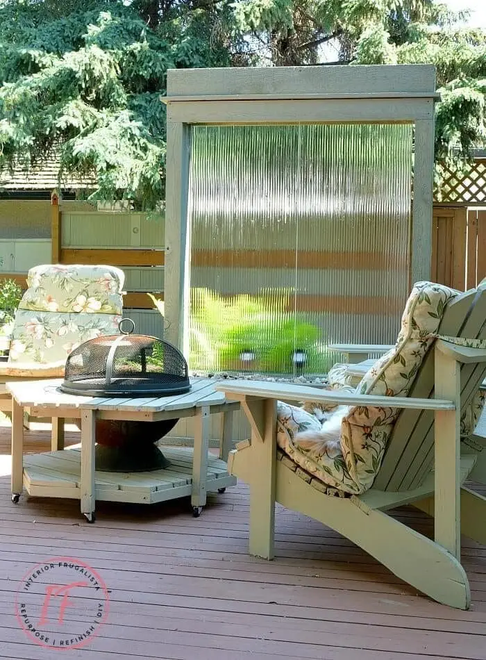 A water wall sitting on a deck in the backyard