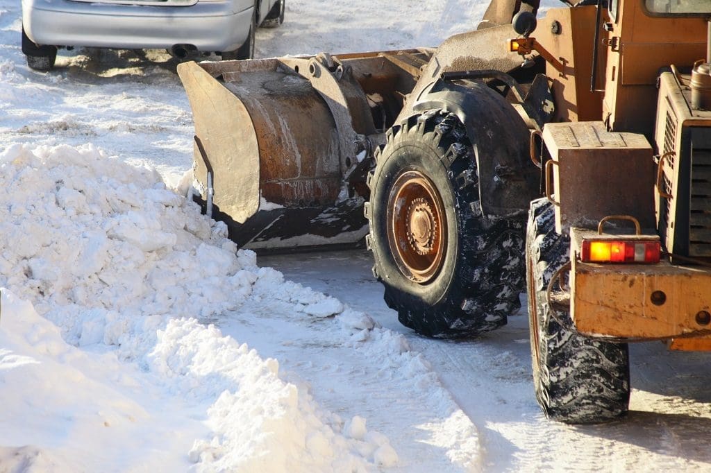 snow removing by tractor.