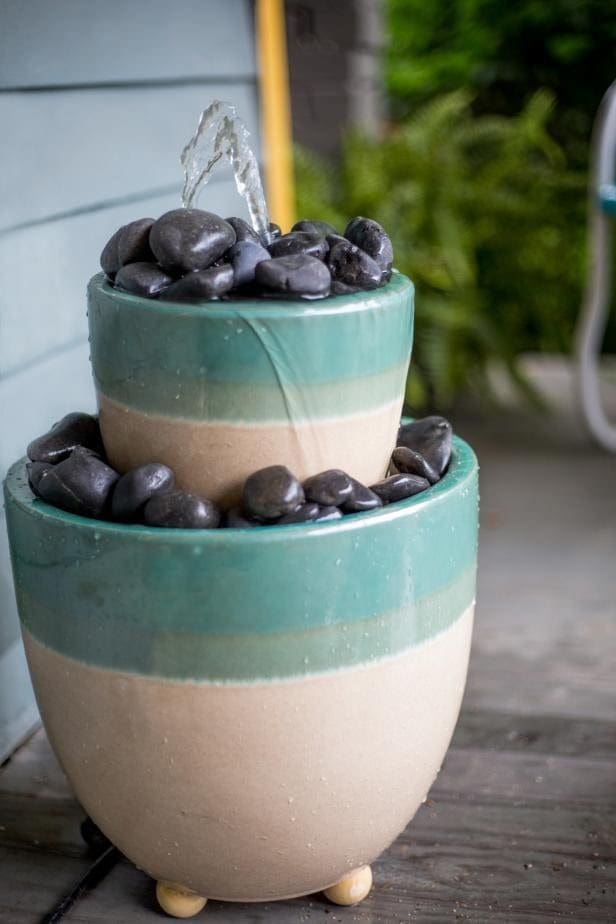 Pots with rocks turned into a water feature