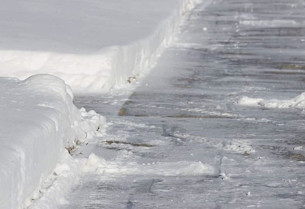 Salting Sidewalk in Winter