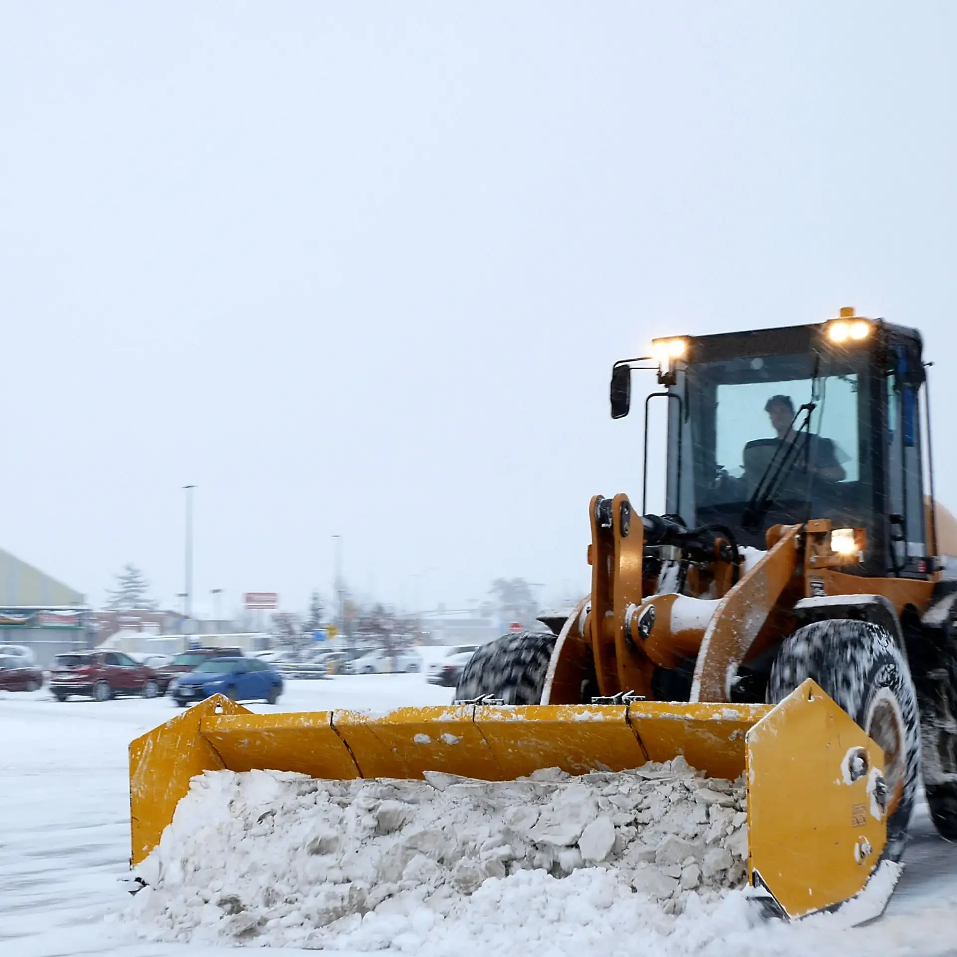 Copy of Loader in Snowy Parking Lot Chicago, IL Commercial Snow Plowing
